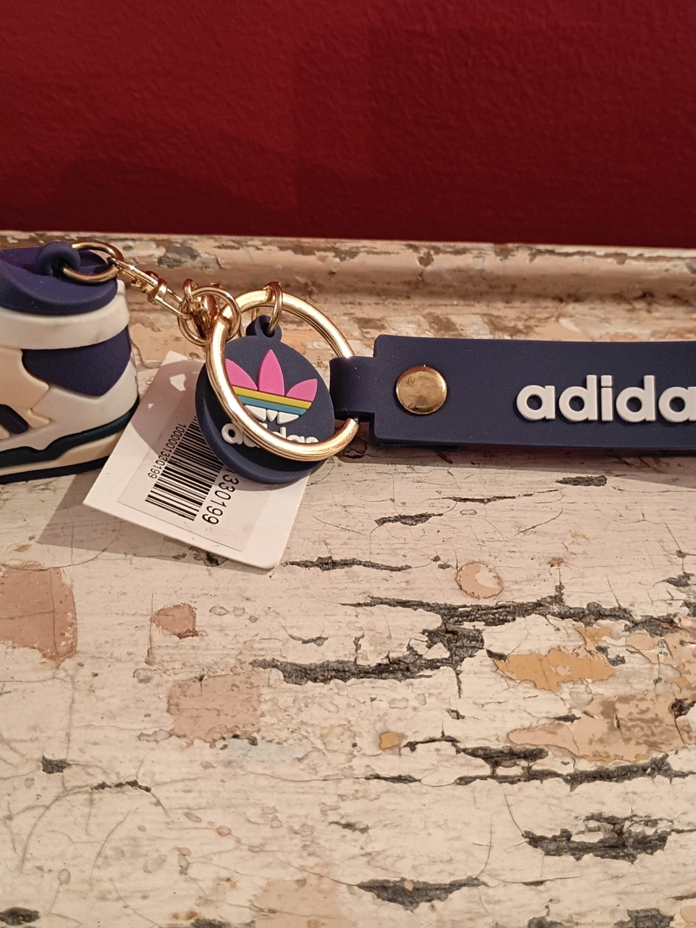 adidas navy blue keychain with pink and green trefoil